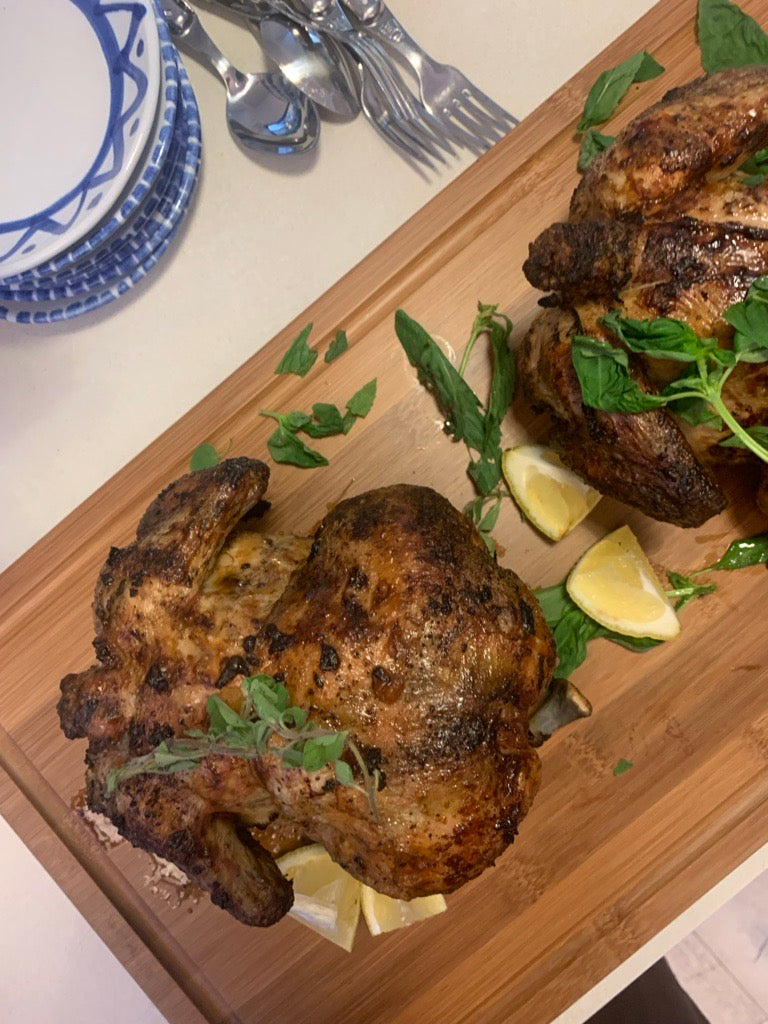 roast chicken on bamboo butcher block with juice groove