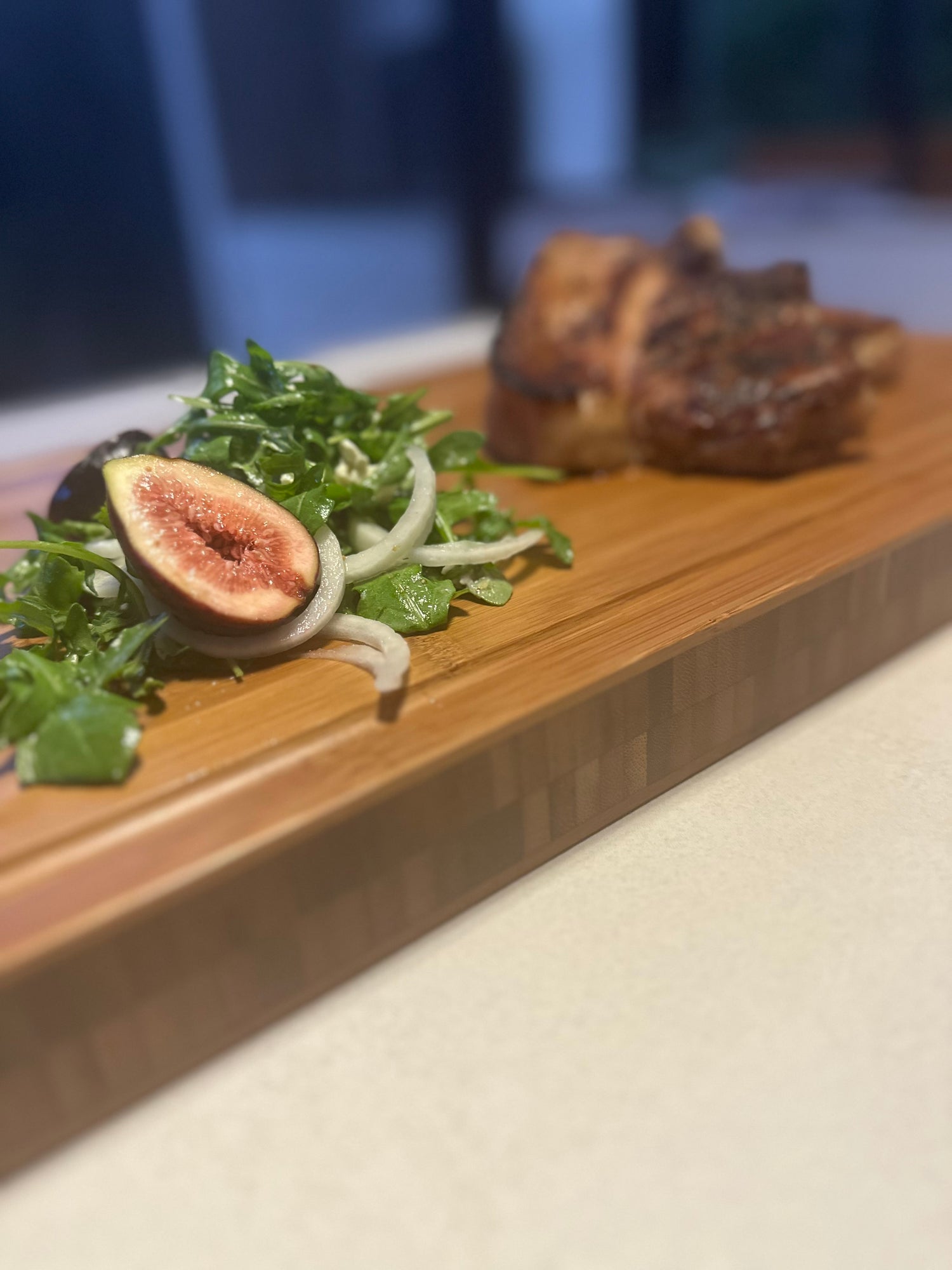 fig salad on bamboo butcher block